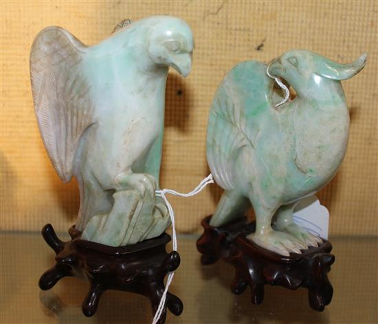 Two Chinese jadeite models of birds, 20th century, 10.4cm and 11cm, wood stands